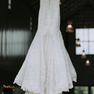 women's white strapless wedding dress hanged on clothes hanger