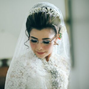 woman wearing white lace top with veil