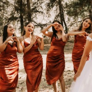 a group of women in dresses