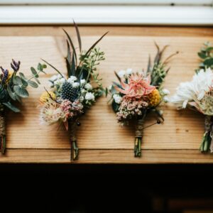 three flower bouquets on table