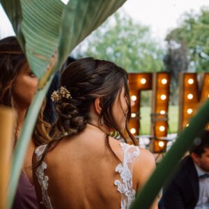 the back of a woman's dress as she sits at a table