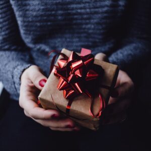 person holding present box